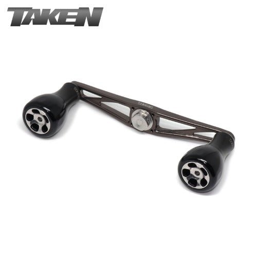 Der Taken AZ100 Handle - Power Handle aus Duraluminium mit H7 Knobs für Shimano & Daiwa in Gunmetal ist auf einem weißen Hintergrund abgebildet, mit dem Taken-Logo in der oberen linken Ecke.