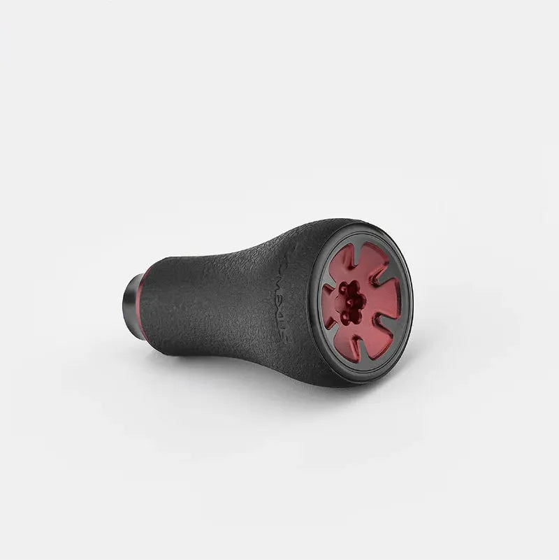 Der Gomexus P20 mm TPE-Knopf ist ein schwarzes, zylindrisches Werkzeug mit einem strukturierten TPE-Griff und einem roten, zahnradförmigen Knopf an einem Ende, der vor einem schlichten weißen Hintergrund angezeigt wird.