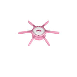 Eine Gomexus Sternbremse 60 mm in Rosa von Gomexus ist von oben auf weißem Hintergrund abgebildet. Sie hat sechs Arme, einen runden Mittelpunkt und einen metallischen Flaschenöffner in der Mitte.