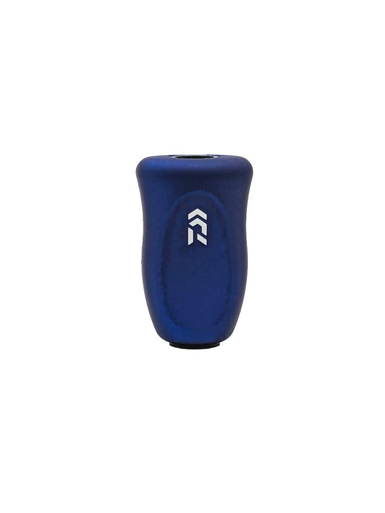 Ein blauer SLP Works RCS i-Shape Korkknopf mit einem ergonomischen Design und einem weißen Pfeil nach oben Logo auf der Vorderseite. Er hat eine glatte Oberfläche, ist wahrscheinlich aus Metall oder Kunststoff und wird vor einem weißen Hintergrund gezeigt.